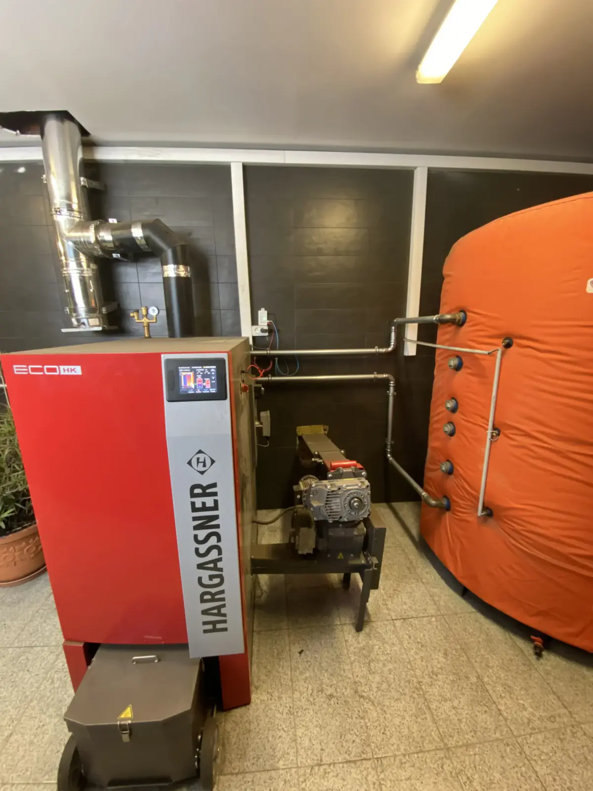 Hargassner boiler and buffer tank in the Delice Pan plant room, Bistrița
